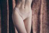 Fototapeta Konie - Cropped photo with no retouch of slender female body menstruation hygiene concept isolated studio background