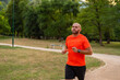 Sporty man running or jogging at the park active healthy lifestyle.