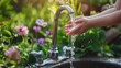 Hands open for drinking tap water. Pouring fresh healthy drink. Good habit. Right choice. Child washes his hand under the faucet in the garden.