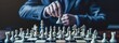 © MOMO - Calculated Chess Move by a Focused Businessman.