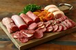 the assorted meat is beautifully sliced and laid on a wooden shelf