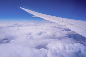 Wall Mural - blue sky with clouds. aerial view from above, out of an airplane window.