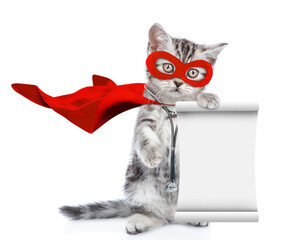 Poster - Cute kitten wearing like a doctor with superhero cape and with stethoscope on his neck standing on hind legs, looks at camera and shows empty list. Isolated on white background