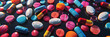 Various vibrant pills and tablets scattered across a tabletop