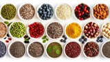 Fototapeta Kuchnia - Assorted superfoods in containers on a solid colored background. A variety of superfoods in small bowls, surrounded by fresh fruits, nuts, and vegetables, highlighting a healthy lifestyle