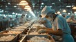 A shrimp factory workers working in a factory
