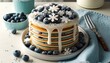 Stacked Blueberry Pancakes with Melting Frosting