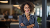 Fototapeta Góry - Young confident black african american business woman smiling in corporate background with copy space. Success, career, leadership, professional, diversity in a workplace concept