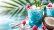 Blue raspberry coconut punch with ice cubes and a sunny background copy space