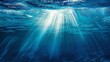 Sun rays piercing blue depths, close-up, low angle, serene underwater light, tranquil sea 