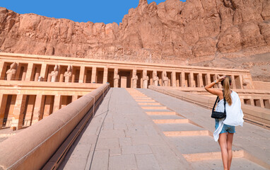 Wall Mural - Hatshepsut Temple at sunrise in Valley of the Kings and red cliffs western bank of Nile river - Luxor- Egypt