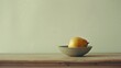 A simple ceramic bowl holding a single piece of fruit on a plain table, the composition a testament to the beauty found in everyday objects.
