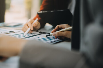 Business team working with new startup project plan and discussion information for financial strategy with laptop and digital tablet in a modern business lounge.