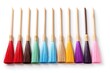 Cleaning brushes of different colors on a white background close-up