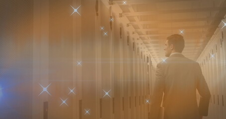 Poster - Image of stars over caucasian businessman in server room