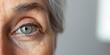 Elderly person's eye with signs of aging.