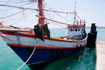 Wall Mural - Traditional fishing boat for crab catching moored at wharf in Phuket, Thailand.