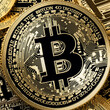 a golden bitcoin in coins background
