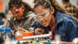 two young girls with goggles are building small, colorful objects