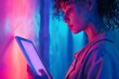 © Markus Schröder - App preview over shoulder of a young girl holding an ebook with a completely neon screen