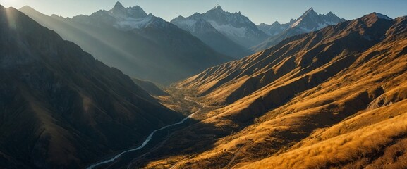 Wall Mural - an aerial shot of mountains in the afternoon with the sun shining through them