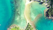 Aerial Top View Of The Ocean Water Washing Two Untouched Islands