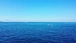 Beautiful view of a calm blue sea with a boat on sunny day in Asia