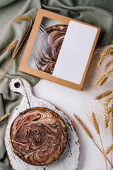 Wall Mural - top view of tasty homemade cake on wooden cutting board