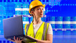 Logistician woman. Girl near oil barrels. World map symbolizes international logistics. Logistician with laptop in hands. Woman dispatcher transport company. Logistician in yellow uniform and helmet