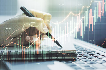 Poster - Multi exposure of abstract financial graph with hand writing in notebook on background, financial and trading concept