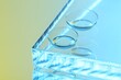 Pair of contact lenses on mirror surface, closeup. Space for text