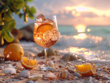 Fototapeta Abstrakcje - Summer coctail Aperol spritz in glass with oranges with water drops, on the sand with tropical sea and beach background, still life