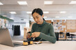 © ReeldealHD images - Chinese woman working on robotic technology in a workspace