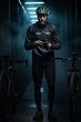 © Liliia - Male cyclist wearing a black sport jacket standing with smartphone and bikes. Vertical orientation