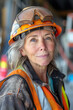 middle-aged or older woman working on a construction site, wearing a hard hat and work vest, smirking confidently.