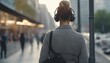 usiness woman listening to music with earphones while commuting in the morning.