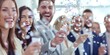 Group of happy business professionals tossing confetti in a celebration, blurred motion.