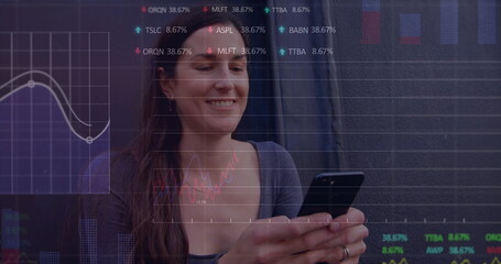 Poster - Image of multiple graphs and trading boards, caucasian woman sitting and using smartphone