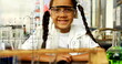 Image of mathematical formulae over smiling schoolgirl