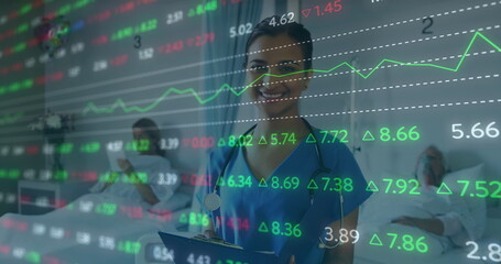 Canvas Print - Image of financial data over happy biracial female doctor making notes