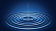   A blue ripple in the water with a single drop emerging from its center, followed by another drop originating from the same point