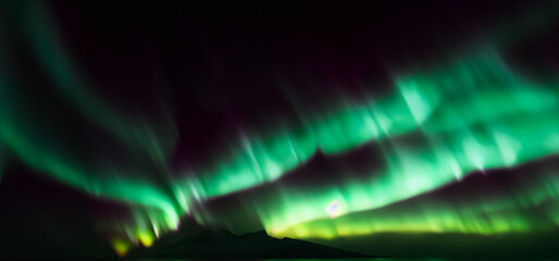 aurora australis or aurora borealis or green northern lights sky above mountains. night sky with pol