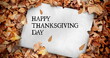 Image of happy thanksgiving day text over card with autumn leaves