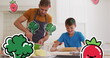 Image of smiling vegetables over happy caucasian father and son cooking at home