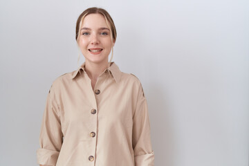 Wall Mural - Young caucasian woman wearing casual shirt with a happy and cool smile on face. lucky person.