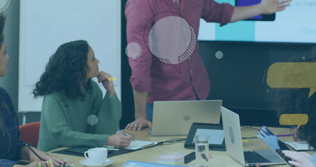 Wall Mural - A diverse group of happy businesspeople discussing work during a meeting at a modern office