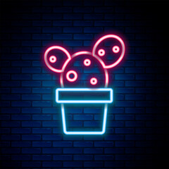 Sticker - Glowing neon line Cactus and succulent in pot icon isolated on brick wall background. Plant growing in a pot. Potted plant sign. Colorful outline concept. Vector