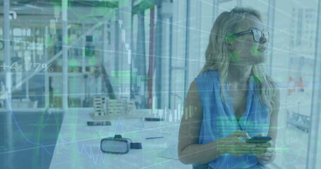 Poster - Image of graphs, computer language on caucasian woman using cellphone and looking through window
