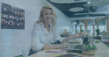Poster - Image of financial data processing over caucasian businesswoman in office