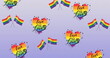 Image of rainbow flags and hearts with love is love texts over blue background